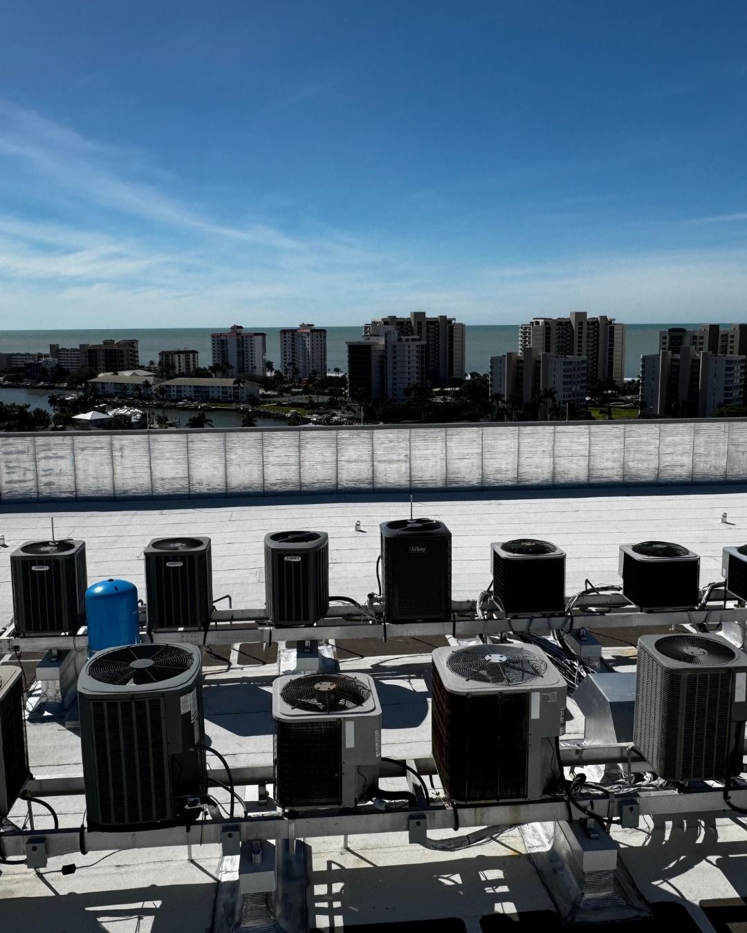 HVAC technician working on an outdoor air conditioning unit